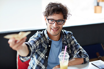 Image showing happy man with cash money paying at cafe