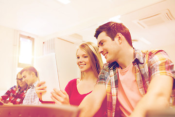 Image showing group of smiling students with tablet pc