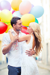 Image showing couple with colorful balloons