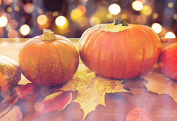 Image showing close up of halloween pumpkins on wooden table