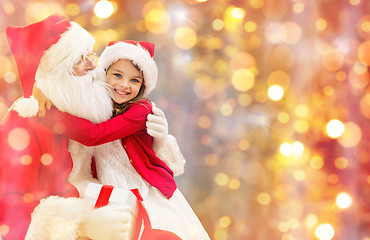 Image showing smiling little girl with santa claus