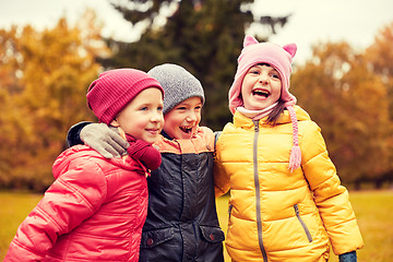 Image showing group of happy children hugging in autumn park