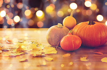 Image showing close up of halloween pumpkins on wooden table