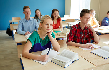 Image showing group of students with books at school lesson