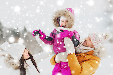 Image showing happy family with child in winter clothes outdoors