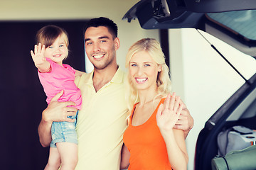 Image showing happy family with hatchback car at home parking