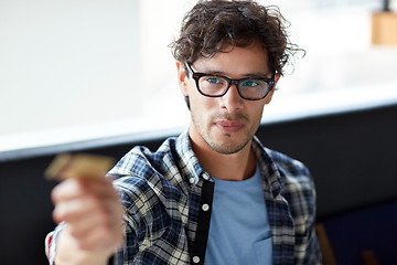 Image showing happy man paying with credit card at cafe