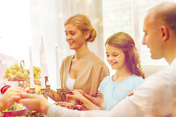 Image showing smiling family having holiday dinner at home