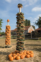 Image showing Ripe autumn pumpkins arranged on totem