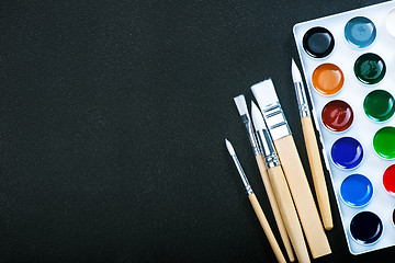 Image showing paint and brushes