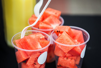 Image showing close up of chopped watermelon in plastic cups