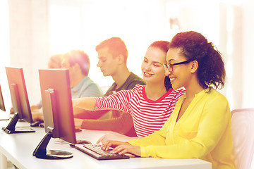 Image showing smiling students in computer class at school