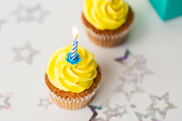 Image showing birthday cupcakes with burning candles