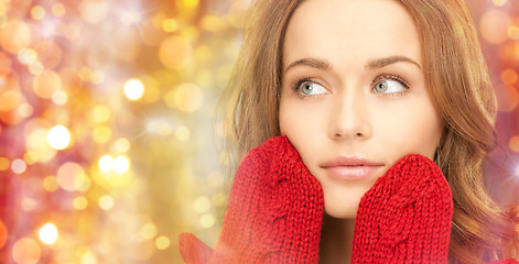 Image showing close up of beautiful woman in red mittens