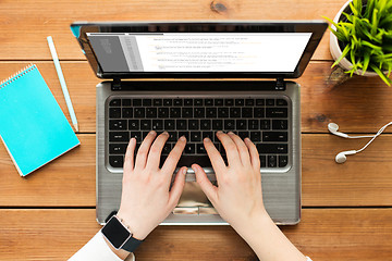 Image showing close up of woman or student typing on laptop