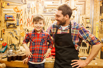 Image showing happy father and little son workshop