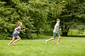 Image showing happy kids running and playing game outdoors