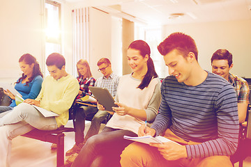 Image showing group of smiling students with tablet pc