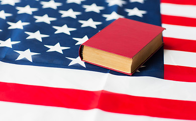 Image showing close up of american flag and book