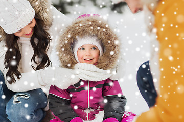 Image showing happy family with child in winter clothes outdoors