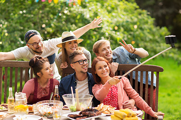 Image showing friends taking selfie at party in summer garden