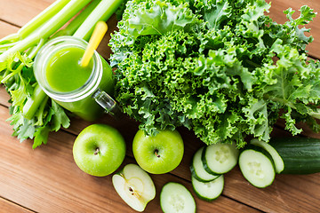 Image showing close up of jug with green juice and vegetables