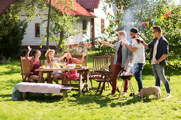 Image showing friends drinking beer at summer barbecue party