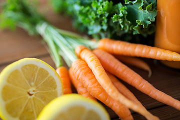 Image showing close up of carrot, lemon and lettuce