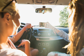 Image showing teenage girls or women with smartphone in car