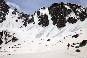 Image showing Hiker in snow mountain with trace from avalanches at sun spring 