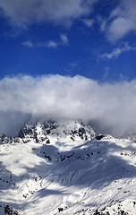 Image showing Mount Ushba in clouds at sun winter day