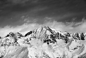 Image showing Black and white snow mountains in winter sun day and sky with cl