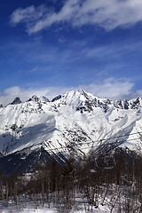 Image showing Ski lift in snow mountains at nice winter day