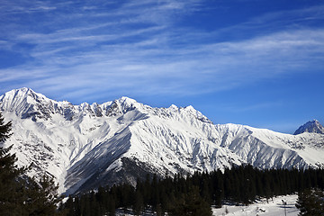 Image showing Winter mountains and ski slope at sun winter day