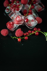 Image showing Frozen berries on wooden table