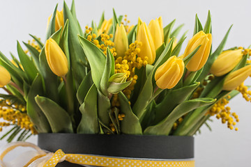 Image showing Bright spring bouquet of tulips and mimosa flowers