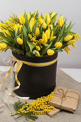 Image showing Bright spring bouquet of tulips and mimosa flowers