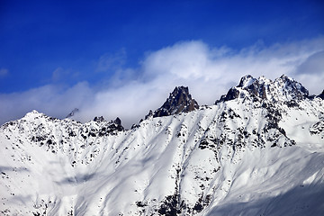 Image showing Snow avalanches mountainside in clouds