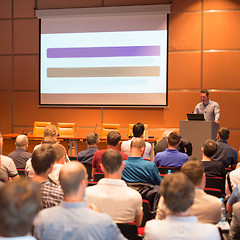 Image showing Business speaker giving a talk in conference hall.