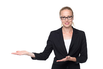 Image showing Business woman showing hand sign to side.