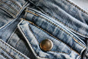 Image showing macro of a used blue pants