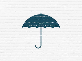 Image showing Safety concept: Umbrella on wall background
