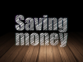 Image showing Finance concept: Saving Money in grunge dark room