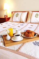 Image showing Breakfast on a bed in a hotel room