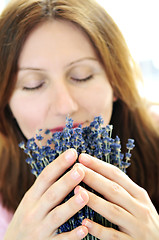 Image showing Woman smelling lavender