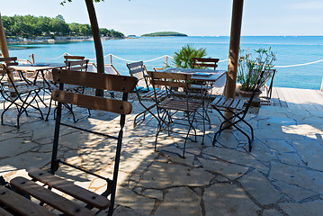 Image showing Chairs and tables with beautiful sea view