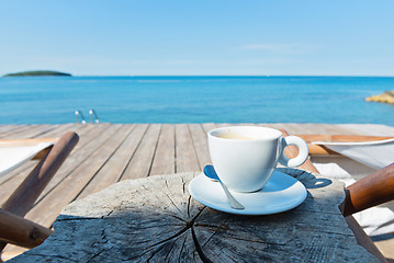 Image showing Wooden floor with chaise-longues and coffee