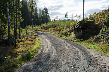 Image showing Backlit gravel road by fall