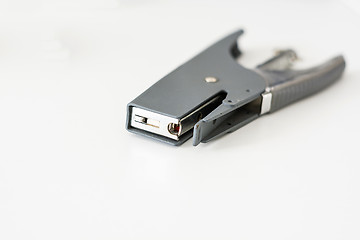 Image showing gray stapler on a white plain