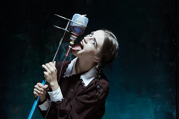 Image showing Portrait of a young girl in school uniform as a vampire woman